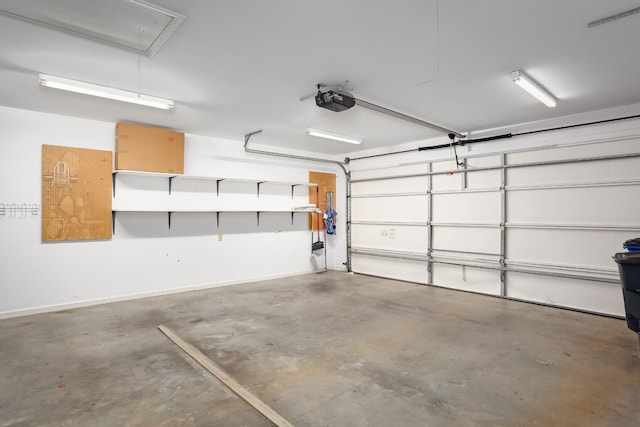 garage featuring baseboards and a garage door opener