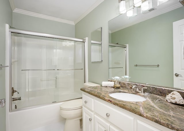 bathroom with toilet, bath / shower combo with glass door, visible vents, vanity, and ornamental molding