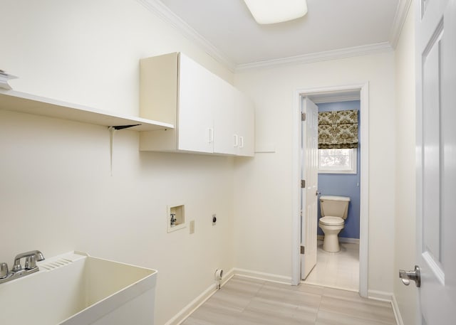 clothes washing area with cabinet space, ornamental molding, hookup for an electric dryer, washer hookup, and a sink