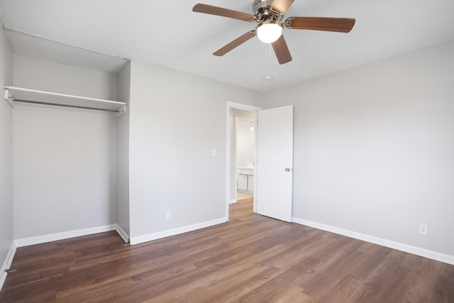 unfurnished bedroom with ceiling fan, a closet, wood finished floors, and baseboards