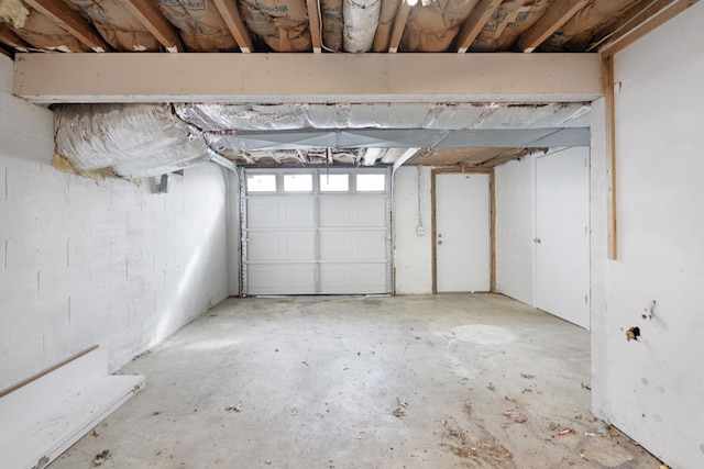 garage featuring concrete block wall