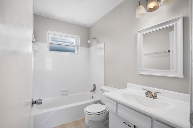 full bathroom featuring a textured ceiling, vanity, shower / tub combination, and toilet