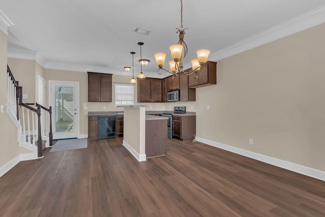 kitchen with visible vents, dark wood-style floors, ornamental molding, a center island, and stainless steel appliances