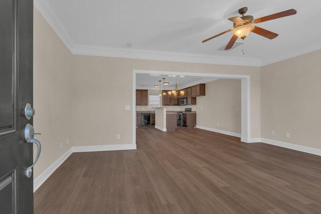 unfurnished living room with ornamental molding, dark wood finished floors, baseboards, and ceiling fan with notable chandelier