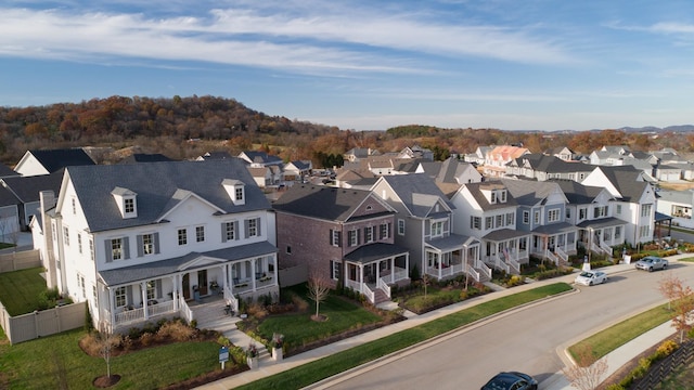 birds eye view of property with a residential view