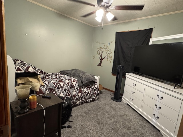 bedroom featuring baseboards, carpet flooring, a ceiling fan, and crown molding