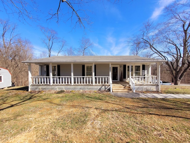 view of front facade with covered porch and a front lawn