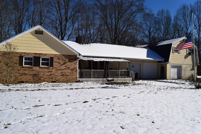 view of front of house with crawl space, a chimney, and brick siding