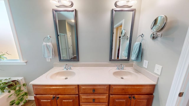 bathroom with a sink and double vanity