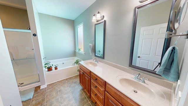 bathroom featuring a shower stall, a bath, double vanity, and a sink