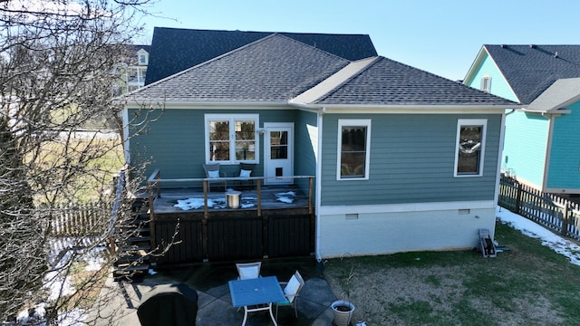 back of house featuring crawl space, a yard, roof with shingles, and fence