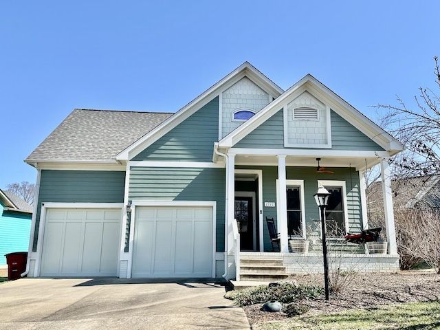 view of front of home featuring a porch, concrete driveway, an attached garage, and a shingled roof