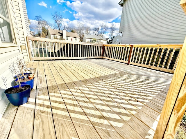 wooden deck with a residential view