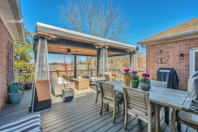 deck featuring an outdoor hangout area, outdoor dining space, and grilling area