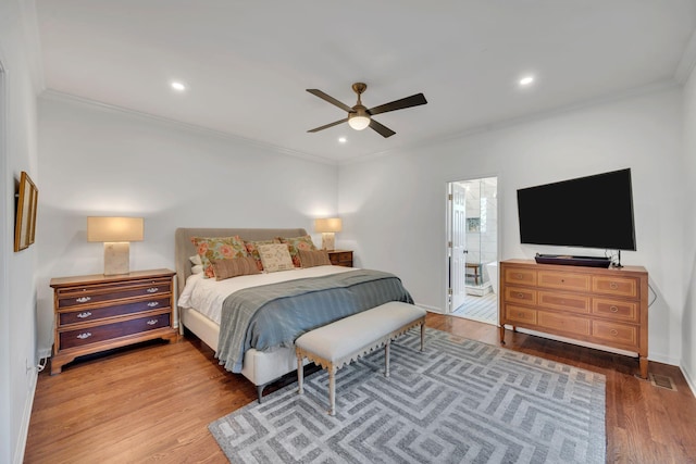 bedroom with baseboards, ornamental molding, wood finished floors, and recessed lighting