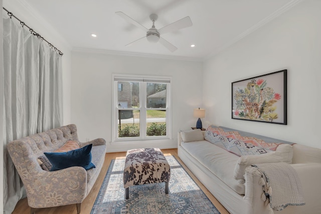 living area featuring recessed lighting, wood finished floors, and crown molding