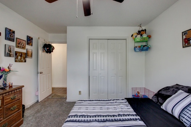 bedroom with carpet, baseboards, ceiling fan, and a closet