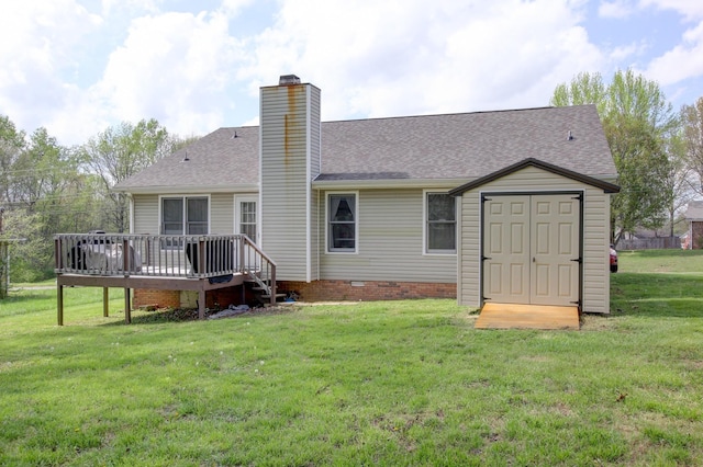 back of property featuring an outbuilding, crawl space, a lawn, a storage unit, and a chimney