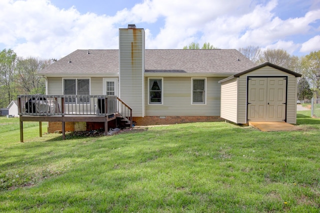 back of house featuring a storage shed, a chimney, an outbuilding, crawl space, and a wooden deck