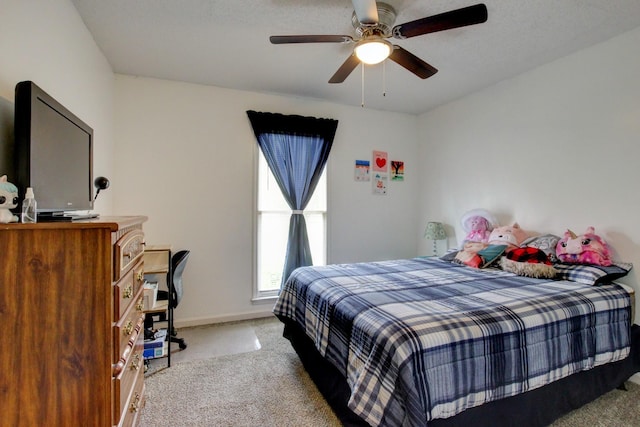 bedroom with carpet, baseboards, and ceiling fan