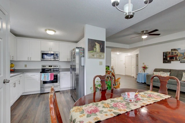 dining space featuring a ceiling fan and dark wood finished floors