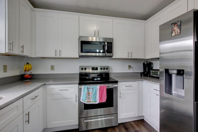 kitchen featuring appliances with stainless steel finishes and white cabinets