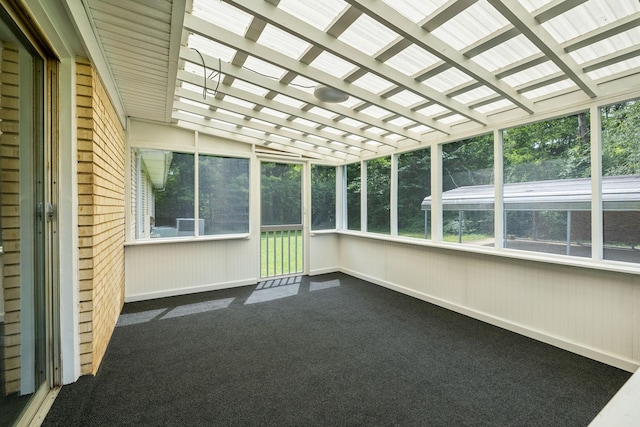 unfurnished sunroom with lofted ceiling