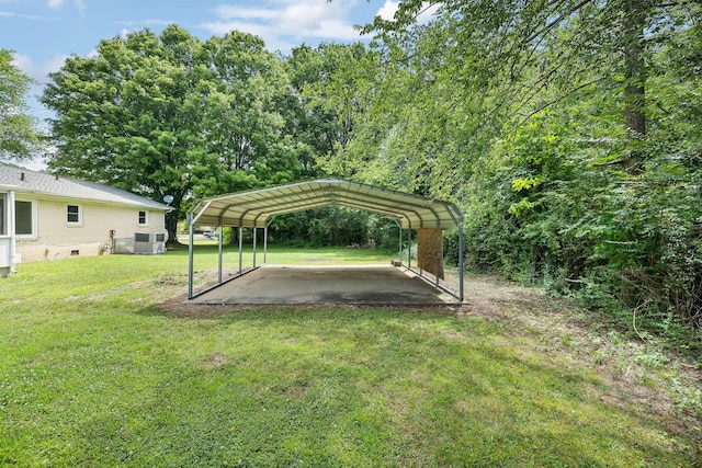 view of yard with a carport and central air condition unit