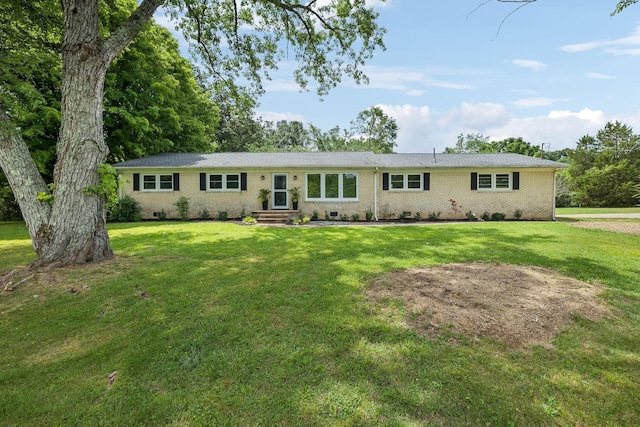 ranch-style house featuring brick siding, crawl space, and a front yard