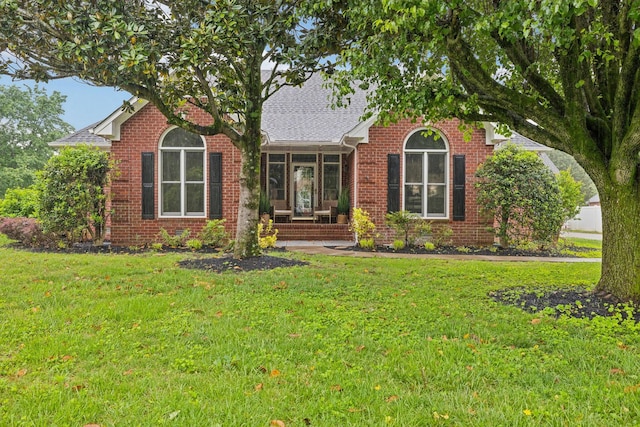 1823 Newton Ave, Murfreesboro, TN 37129 - view of front of property with a front yard, brick siding, and roof with shingles