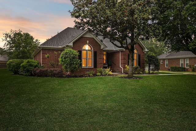 1823 Newton Ave, Murfreesboro, TN 37129 - view of front of property with brick siding, a front yard, and roof with shingles