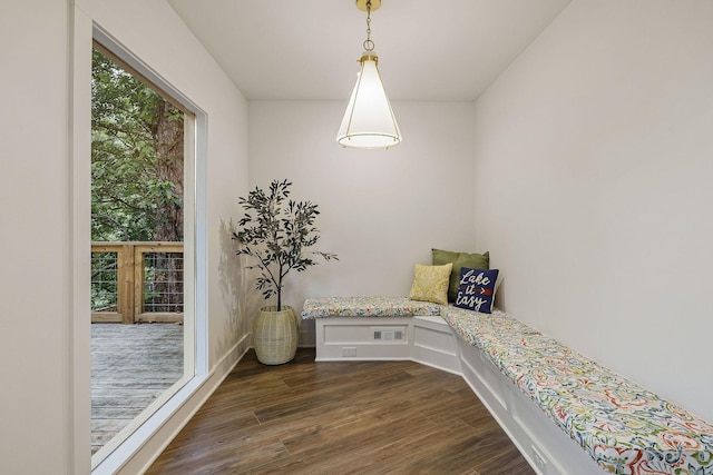 sitting room with visible vents and dark wood finished floors