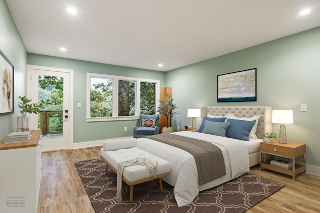 bedroom featuring multiple windows, baseboards, and wood finished floors