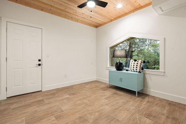 interior space with wood ceiling, baseboards, ceiling fan, and light wood-style flooring