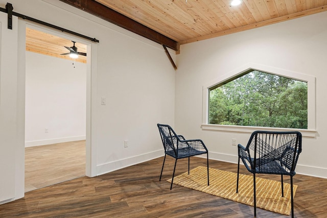 living area featuring a barn door, wood finished floors, wood ceiling, and baseboards