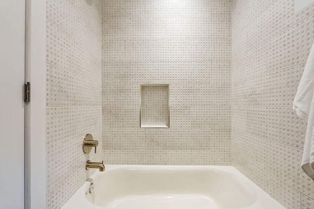 bathroom featuring washtub / shower combination