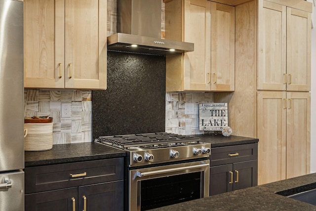 kitchen featuring wall chimney exhaust hood, light brown cabinetry, backsplash, and stainless steel appliances