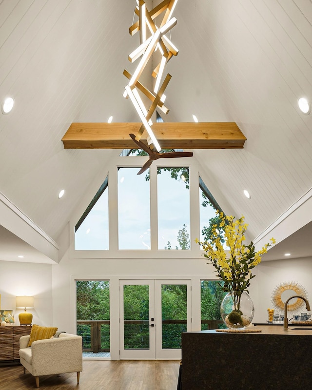 interior details featuring recessed lighting, a sink, wood finished floors, french doors, and beam ceiling