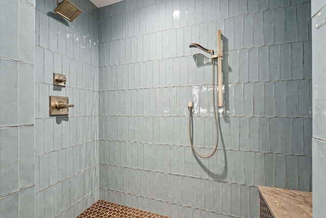 bathroom with tiled shower