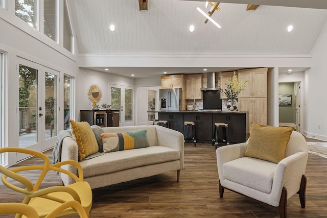 living area featuring high vaulted ceiling, french doors, and dark wood-type flooring