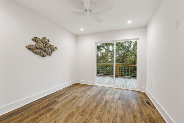 unfurnished room with recessed lighting, visible vents, baseboards, and wood finished floors