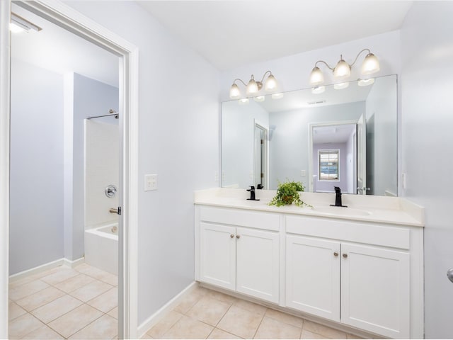 bathroom with double vanity, baseboards, tile patterned floors, shower / bathtub combination, and a sink