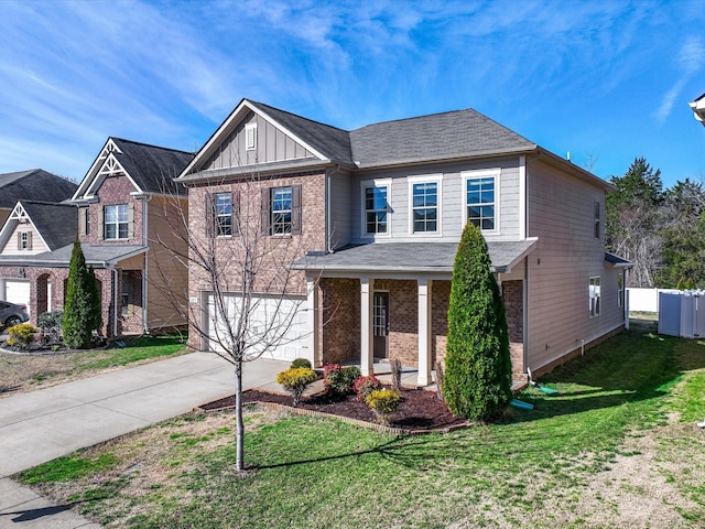 view of front of property featuring driveway, a garage, a front lawn, board and batten siding, and brick siding