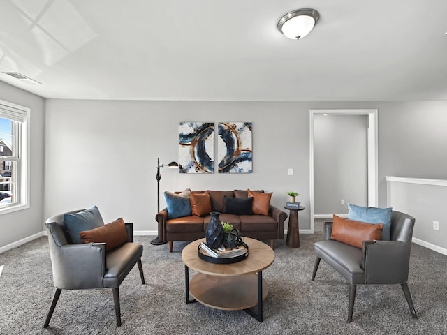 living room featuring carpet floors and baseboards