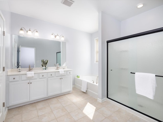 bathroom featuring tile patterned flooring, a garden tub, visible vents, a shower stall, and double vanity