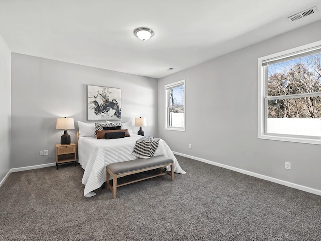 carpeted bedroom with baseboards and visible vents