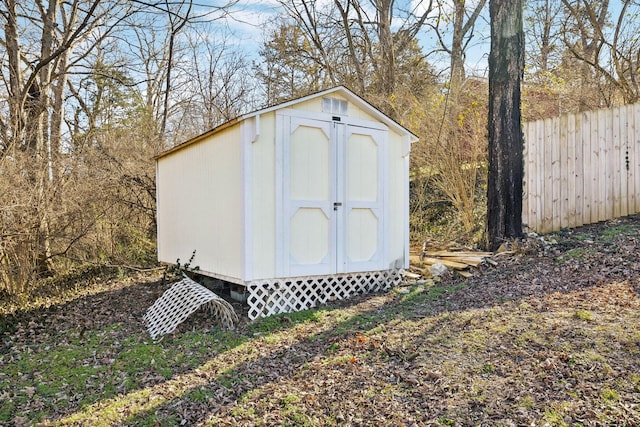 view of shed with fence