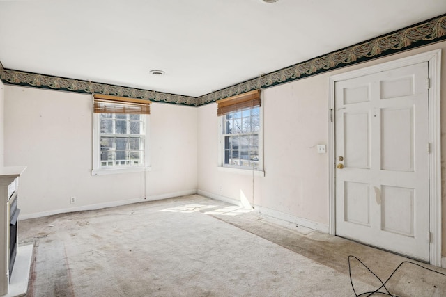 interior space featuring carpet floors, visible vents, and baseboards