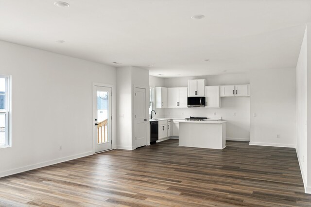 2383 Nelson Way, Cookeville, TN 38506 - kitchen with dishwasher, stainless steel microwave, baseboards, dark wood-type flooring, and recessed lighting