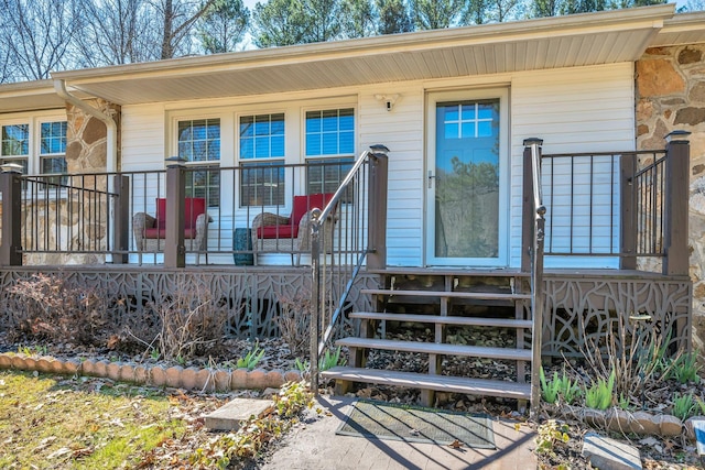 doorway to property featuring covered porch